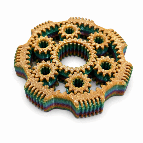 3D geprinte fidget met draaiende tandwielen in beige en groen
