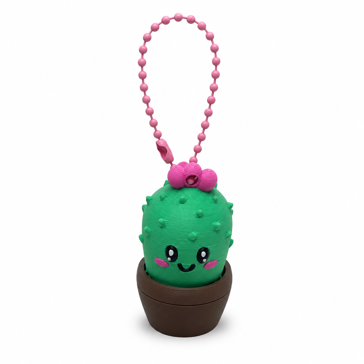 3D geprinte clicker sleutelhanger in de vorm van een cactus in groen, bruin en roze