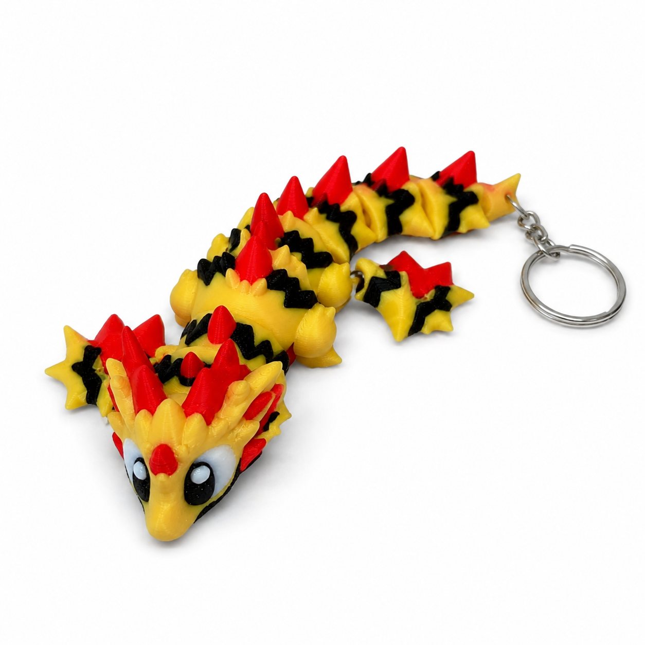 3D geprinte draak sleutelhanger in zwart, geel en rood