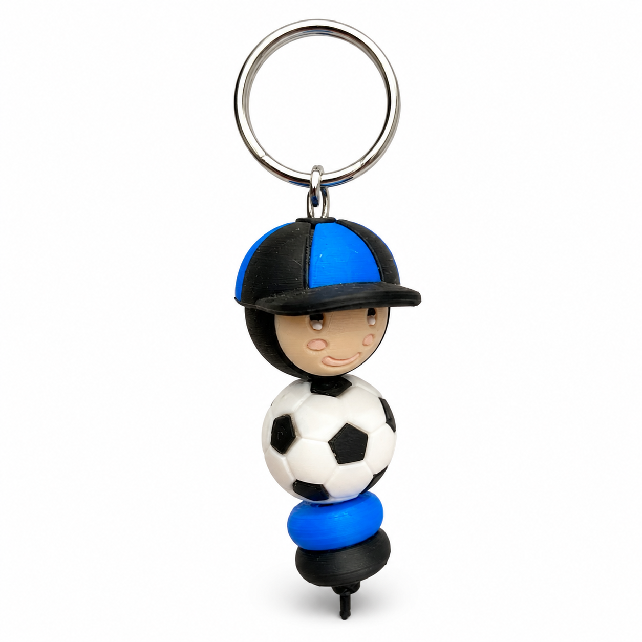 Sleutelhanger met voetballer in blauw-zwarte outfit en voetbal